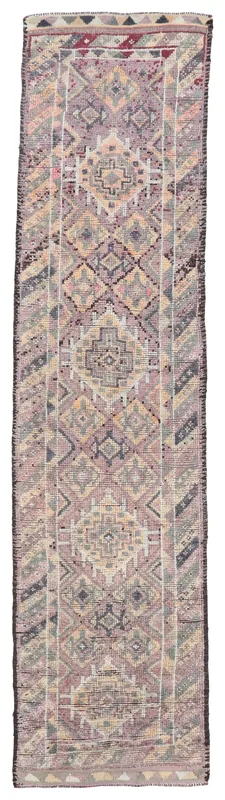 Full top view of a 2'9" x 12'3" vintage Anatolian runner rug with purple, gray, and beige geometric patterns.