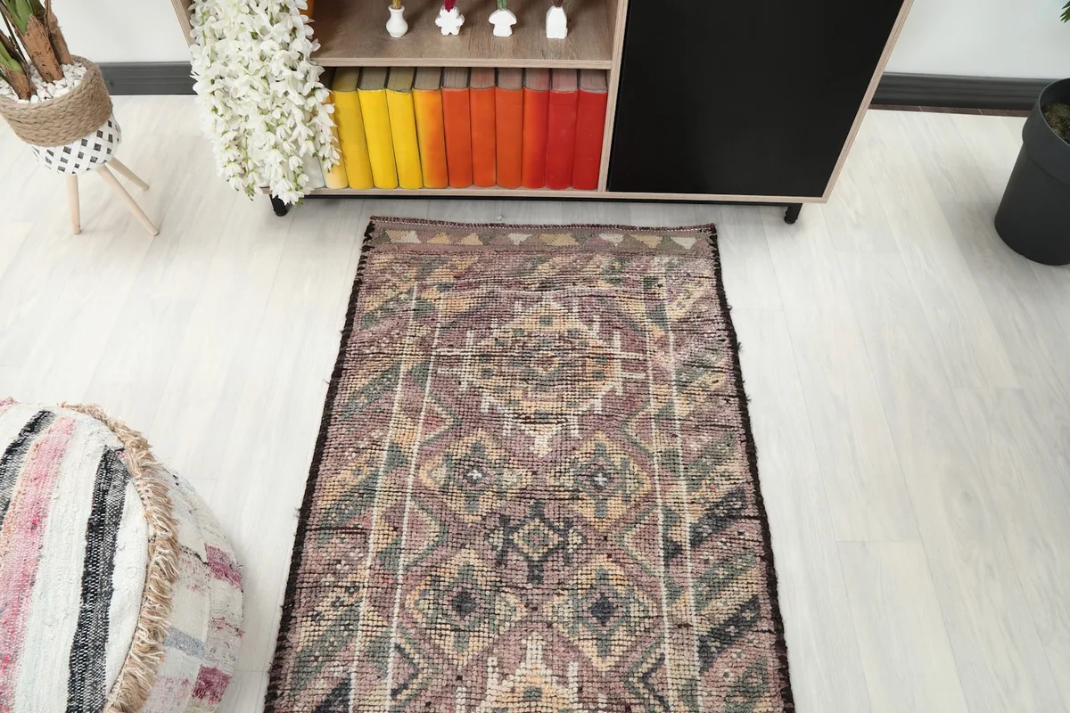 Overhead view of a section of the runner rug in a room, emphasizing its length and pattern flow.