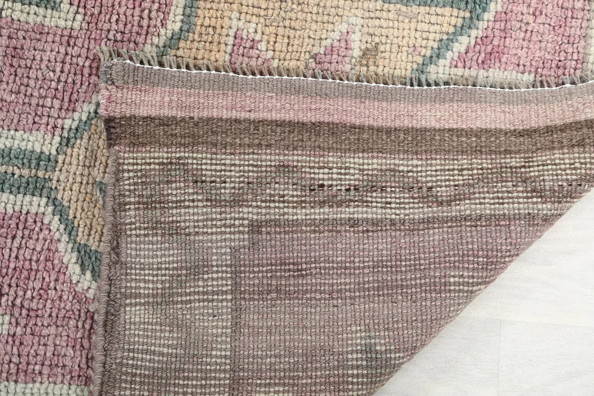 Close-up of the cotton foundation and the back of the hand-knotted wool pile