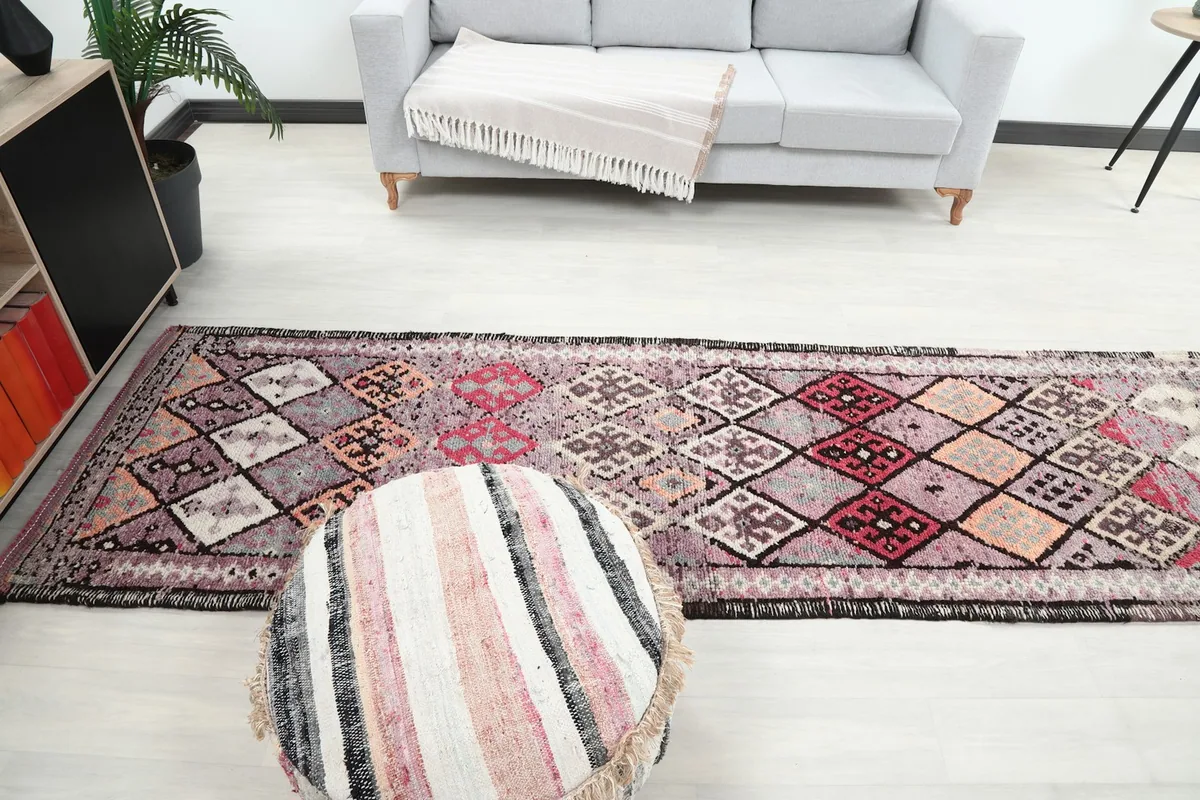 Wide overhead view of the runner rug in a room, demonstrating its scale and how it complements the surrounding decor.