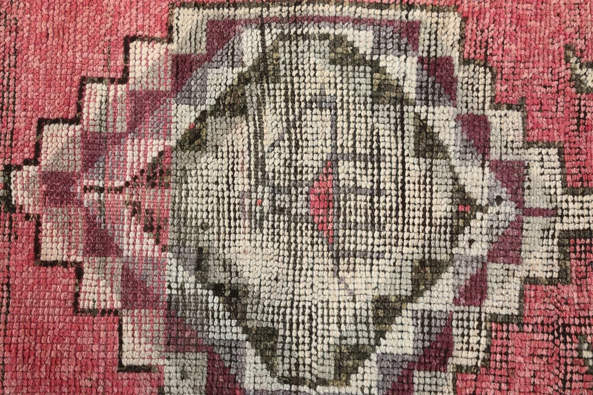 Detailed view of the low pile and texture of the hand-knotted wool