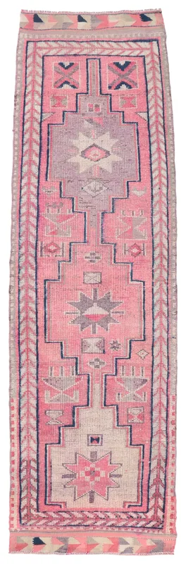 Full overhead view of the rose, gray, and navy geometric Anatolian runner rug