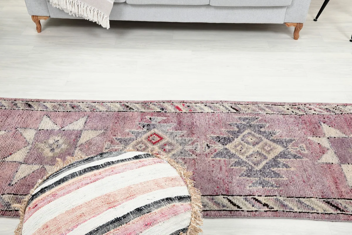 Angled view of the runner rug's length and geometric patterns in a room setting