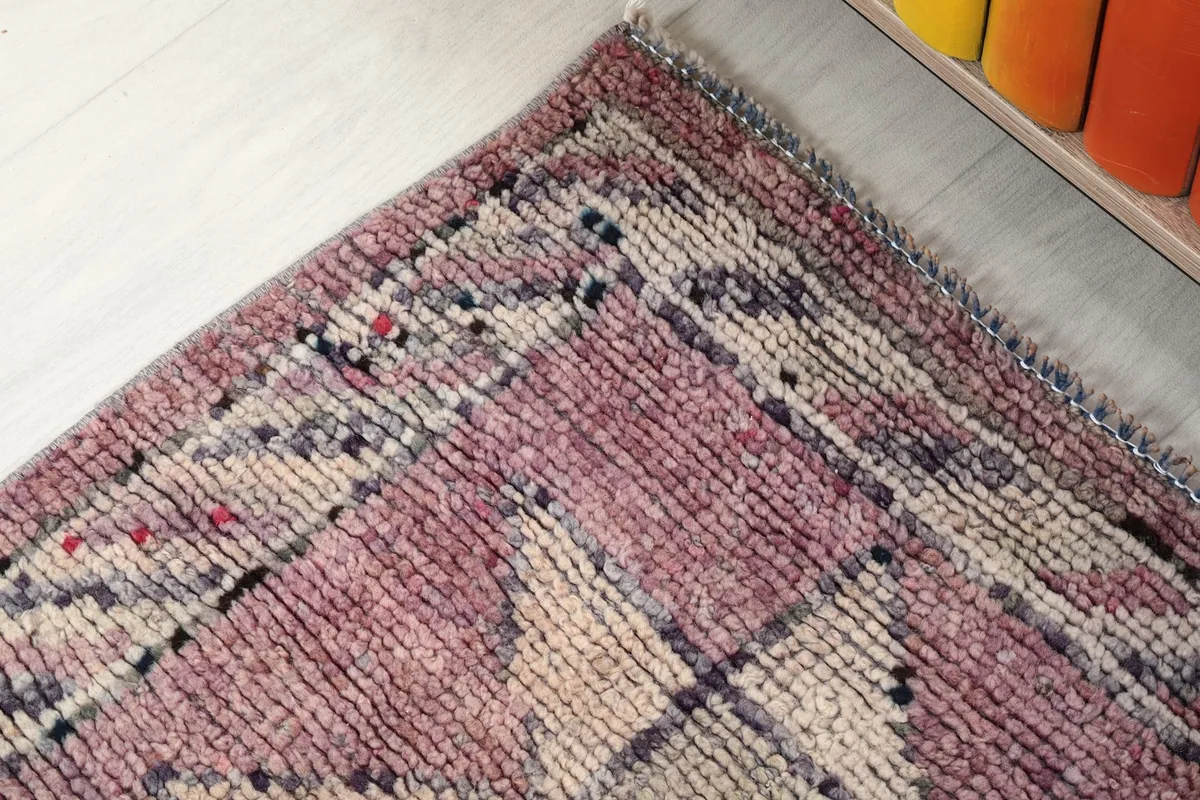 Detail of the border design with striped patterns and subtle color shifts