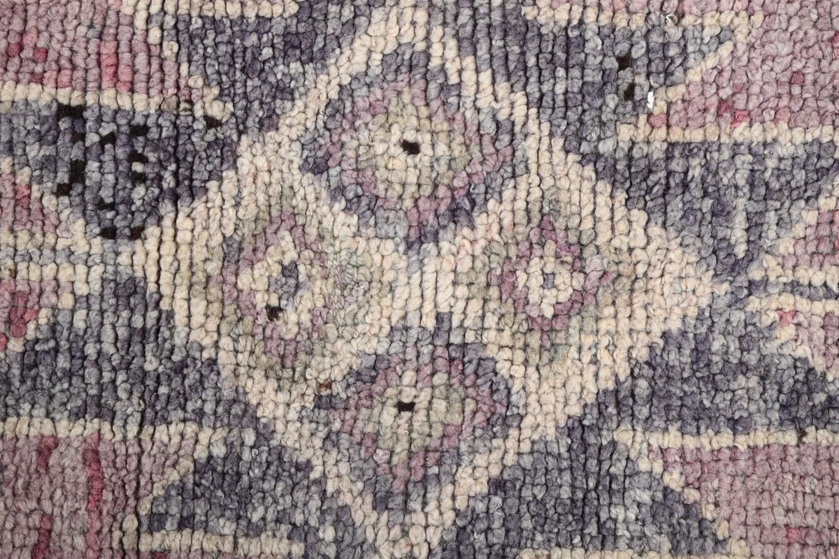 Macro shot showing the hand-knotted wool pile texture and color variations