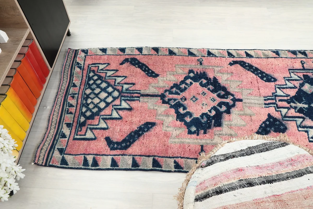 Wide shot of the runner rug from an angle, showcasing the full pattern repeat in the room