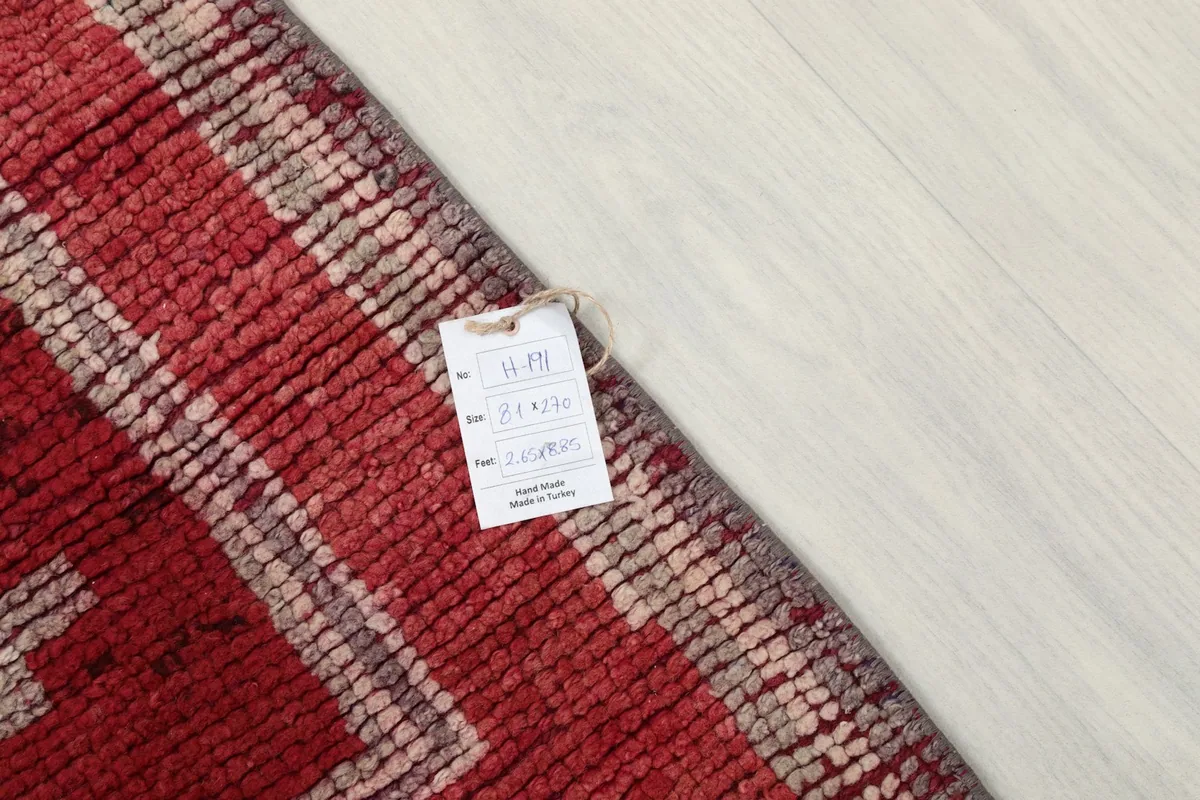 Close-up of the rug's label, indicating its origin and material