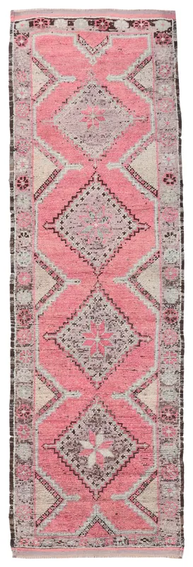 Full top view of the 3'5" x 11'4" vintage Anatolian runner with rose, beige, and gray tribal geometric patterns