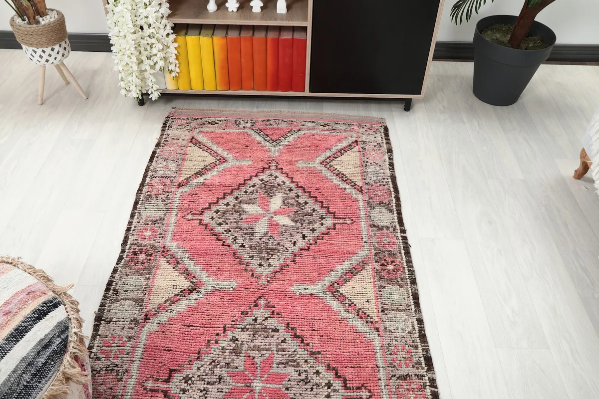 Overhead view of the runner in a room, showing the repeating tribal diamond motifs along its length