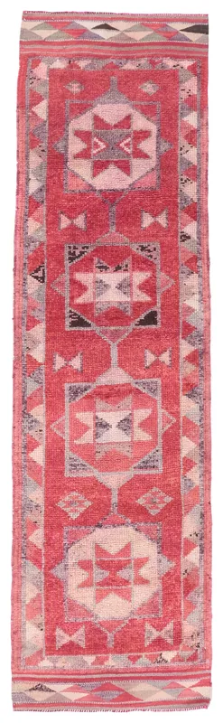 Full overhead view of a red geometric Anatolian vintage runner rug
