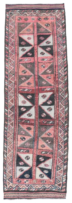Full top view of the 3'6" x 10'8" rose, black, and ivory geometric vintage Anatolian runner rug on a white background.