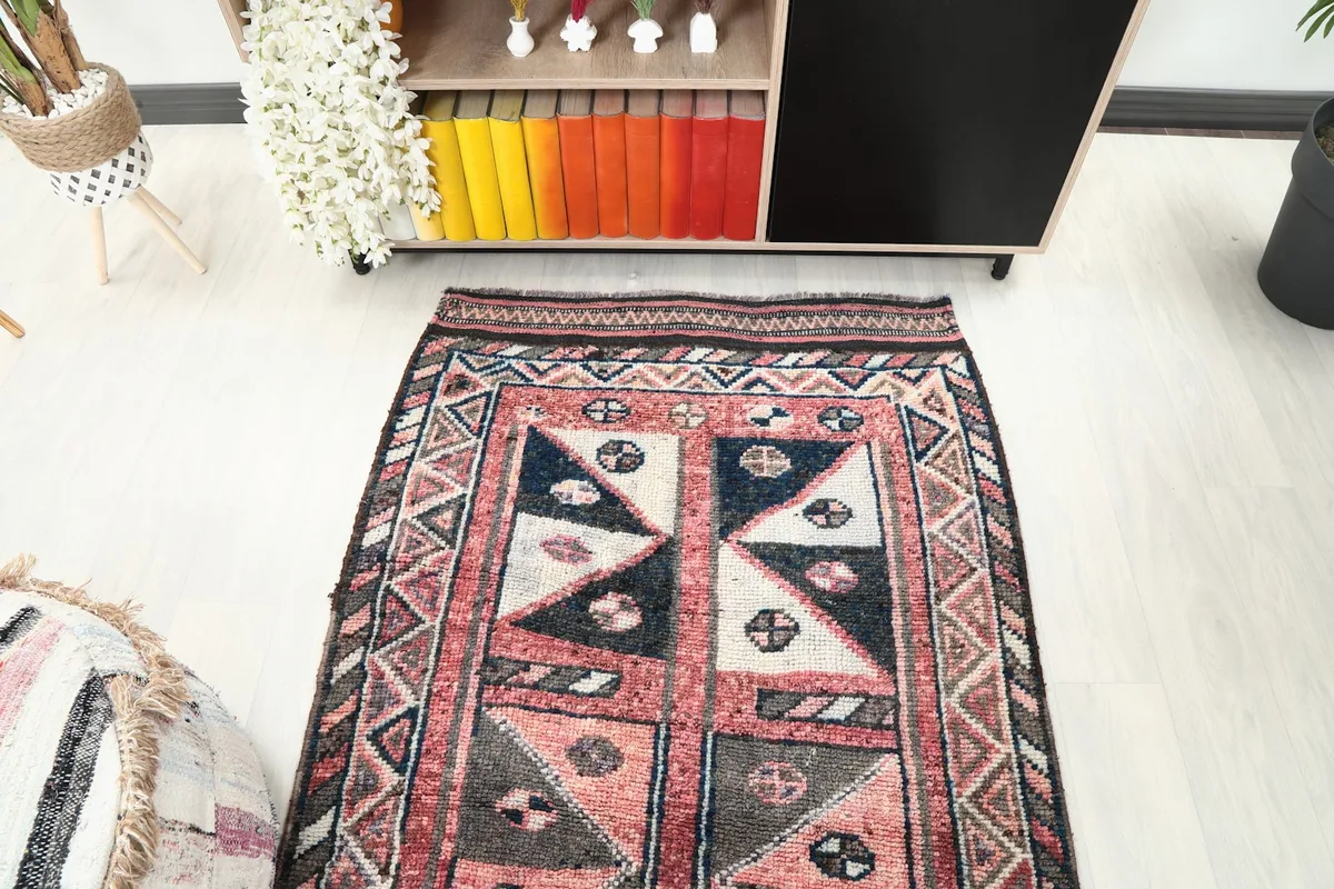 Overhead view showcasing the full width of the runner rug's design and its placement in a room.