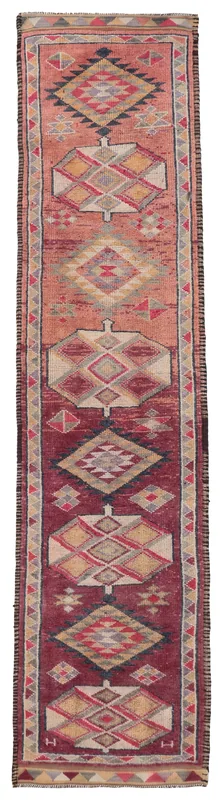 Full top view of the rust and red geometric vintage Anatolian runner rug