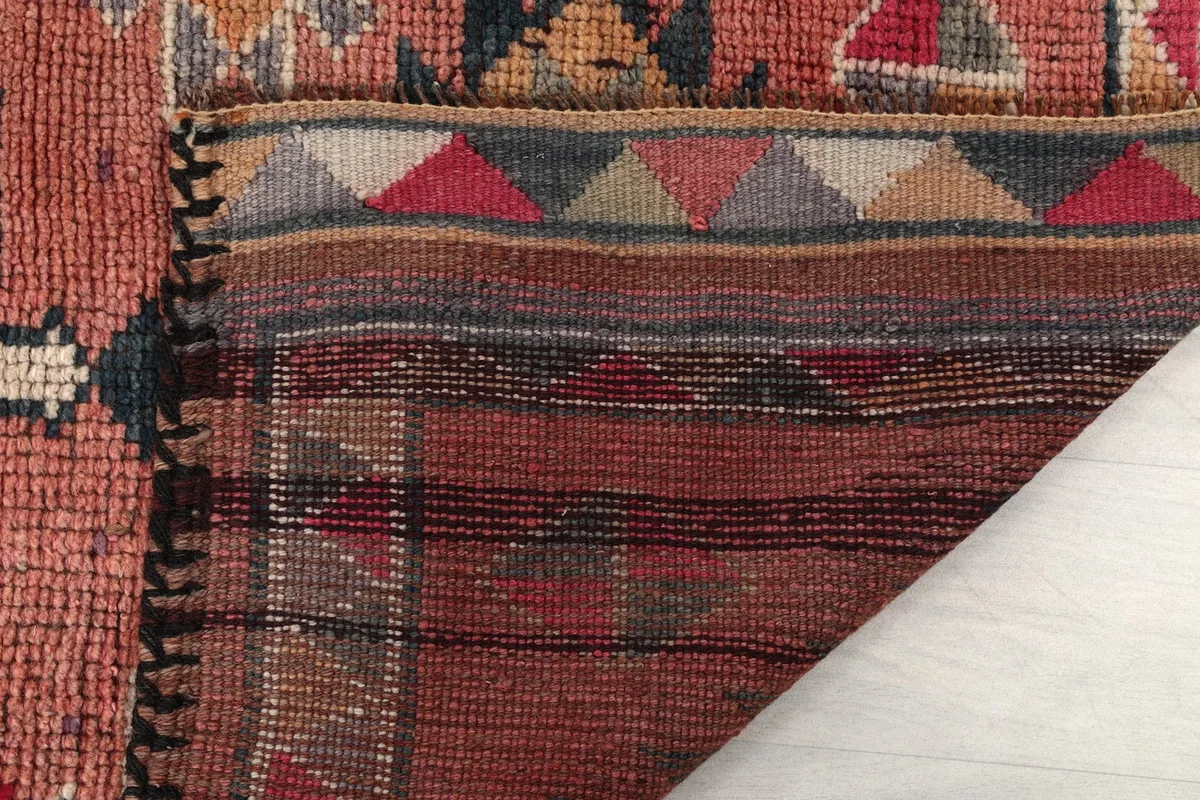 Close-up of the back of the rug, showing the knotting and foundation details
