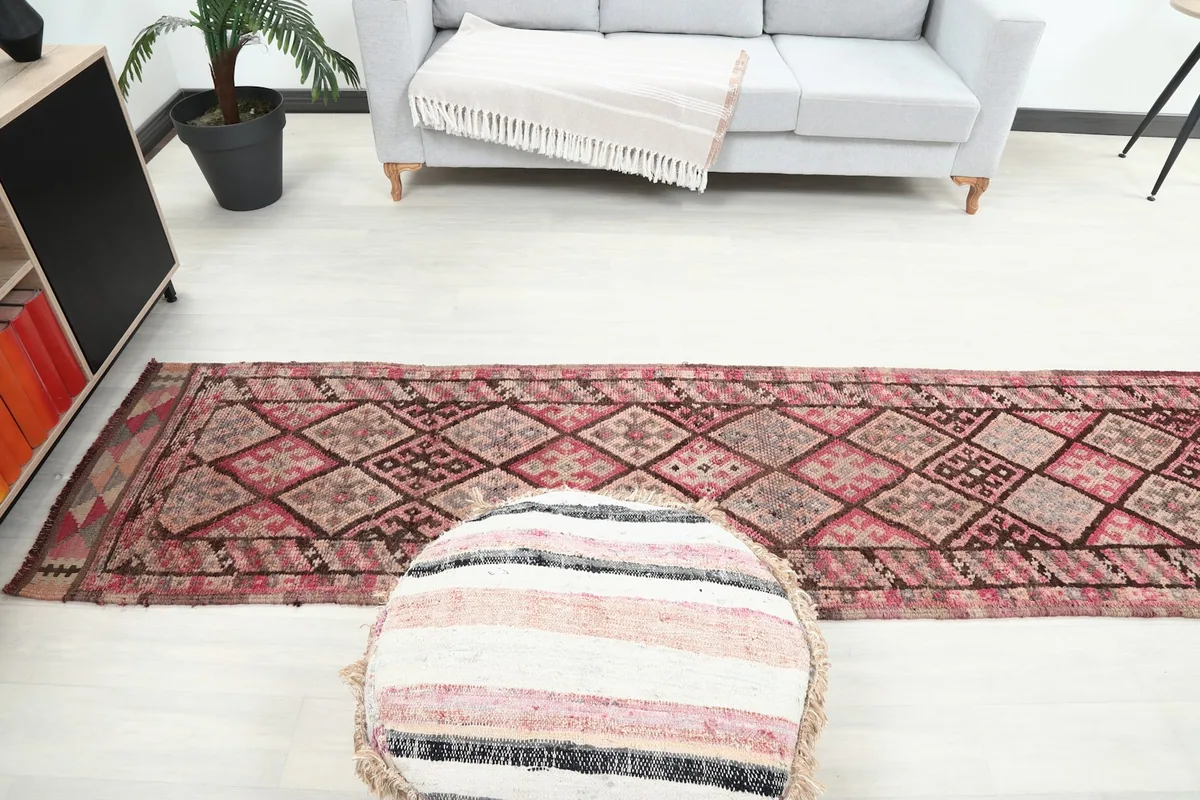 Wide shot of the runner rug in a living area, illustrating its placement and scale within the decor.