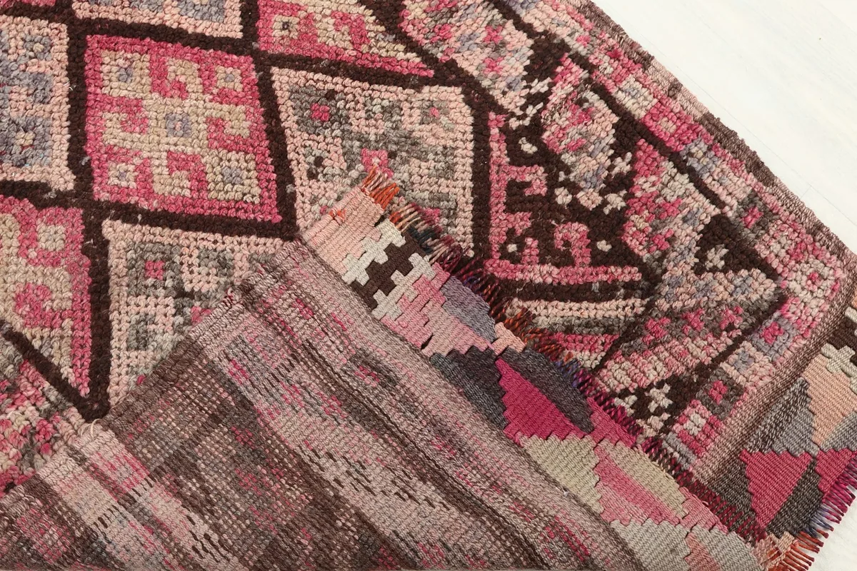 View of the back of the hand-knotted wool runner, revealing the construction and knots.