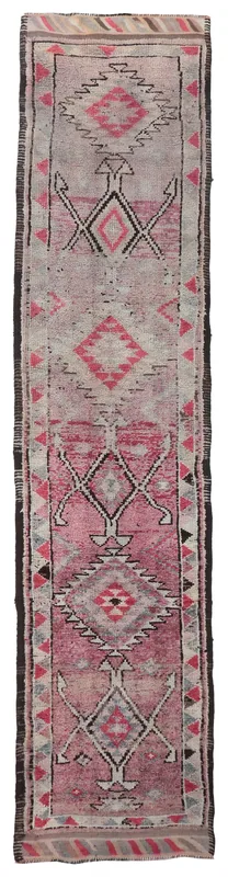 Full overhead view of the 2'9" x 12'6" vintage rose and gray Anatolian runner rug with tribal geometric patterns