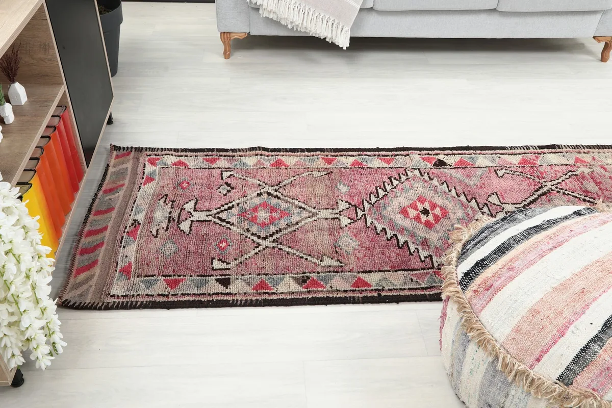 Long view of the Anatolian runner rug in a room, showing its full length and how it defines the space