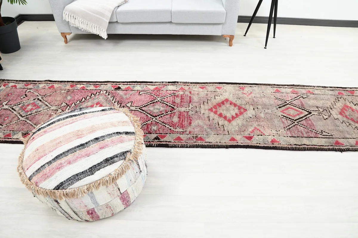 Another angle of the runner rug in a room, emphasizing its narrow shape and tribal aesthetic