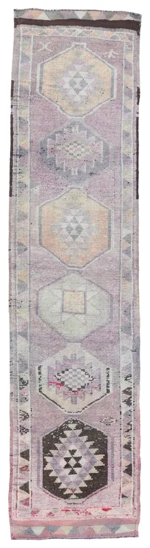 Full top view of the purple geometric Anatolian runner on a white background