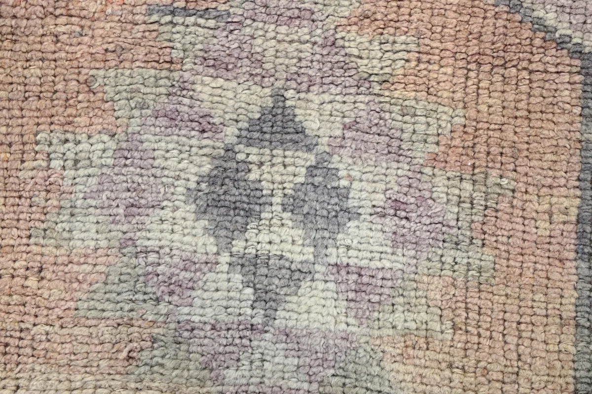 Macro shot of the wool pile and distressed texture of the rug