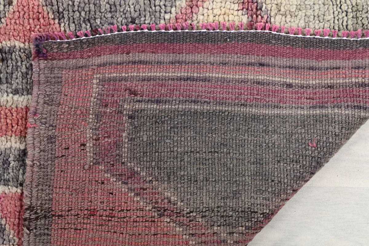 Close-up of the back of the hand-knotted wool runner, revealing the cotton foundation