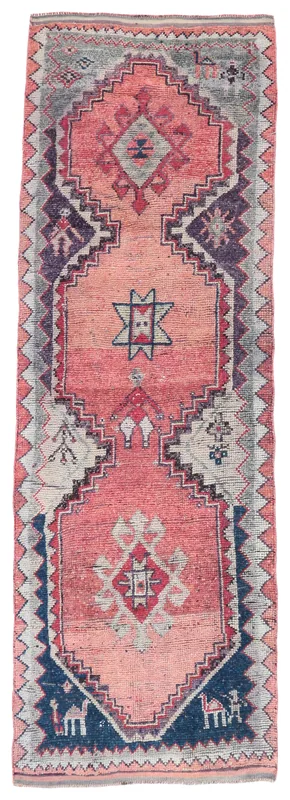 Top view of a 3x10 vintage Anatolian runner rug with rose field and geometric patterns