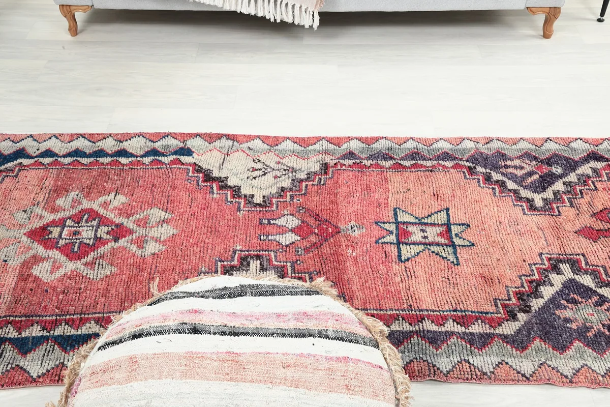 Overhead perspective of the runner rug in a room, emphasizing its long, narrow shape