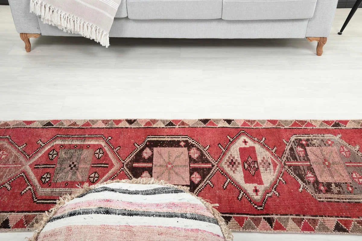 View of the runner from a low angle, showcasing its length in a room setting with furniture