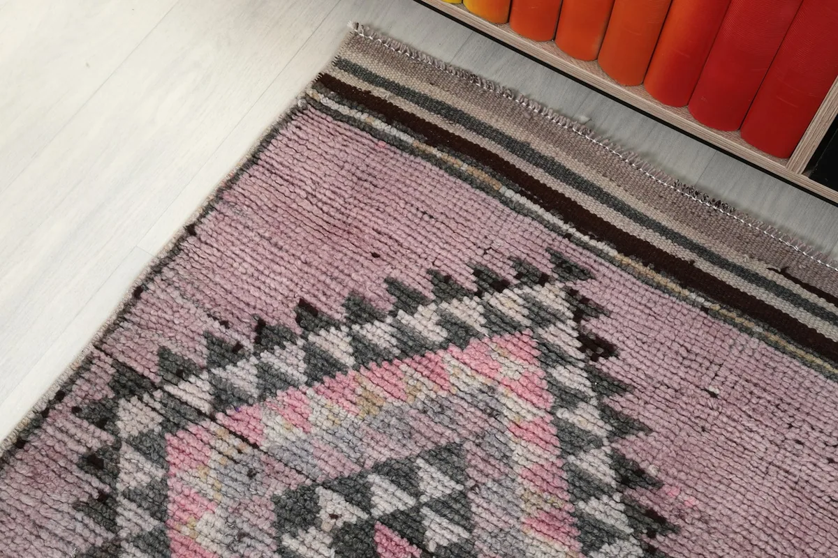 Overhead angle showing the runner rug's end and its placement near furniture