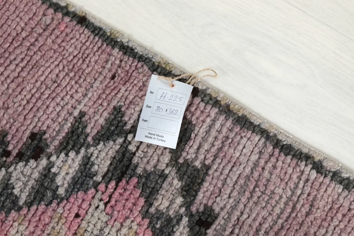 Close-up of the product tag indicating the rug's origin from Turkey and its dimensions