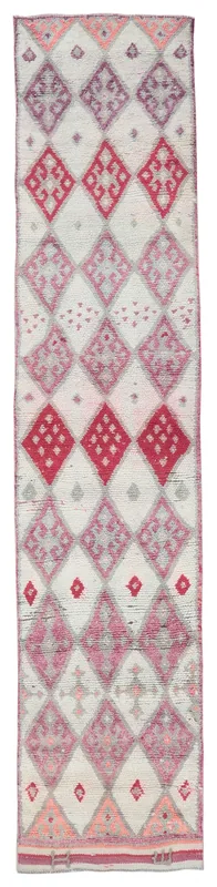 Full overhead view of the ivory, red, and purple geometric vintage runner rug