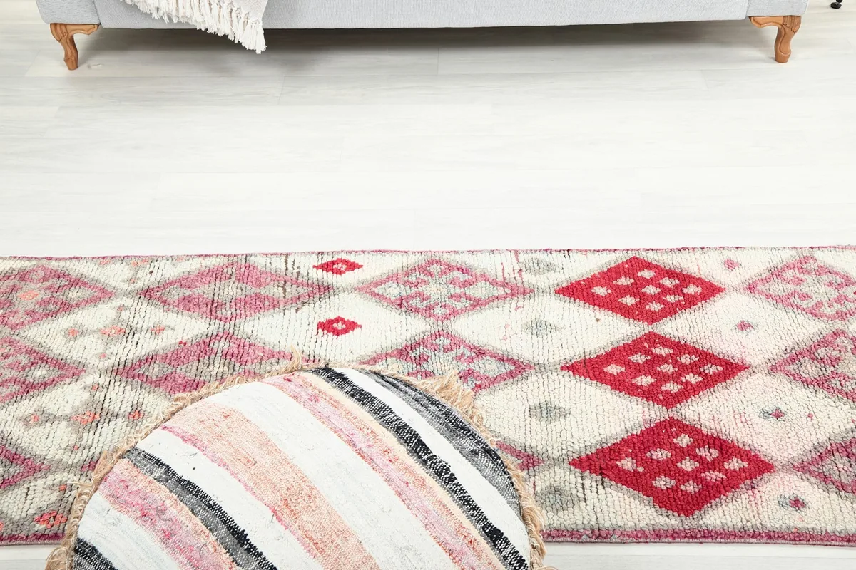 View of the runner rug from a low angle, emphasizing its length and pattern flow