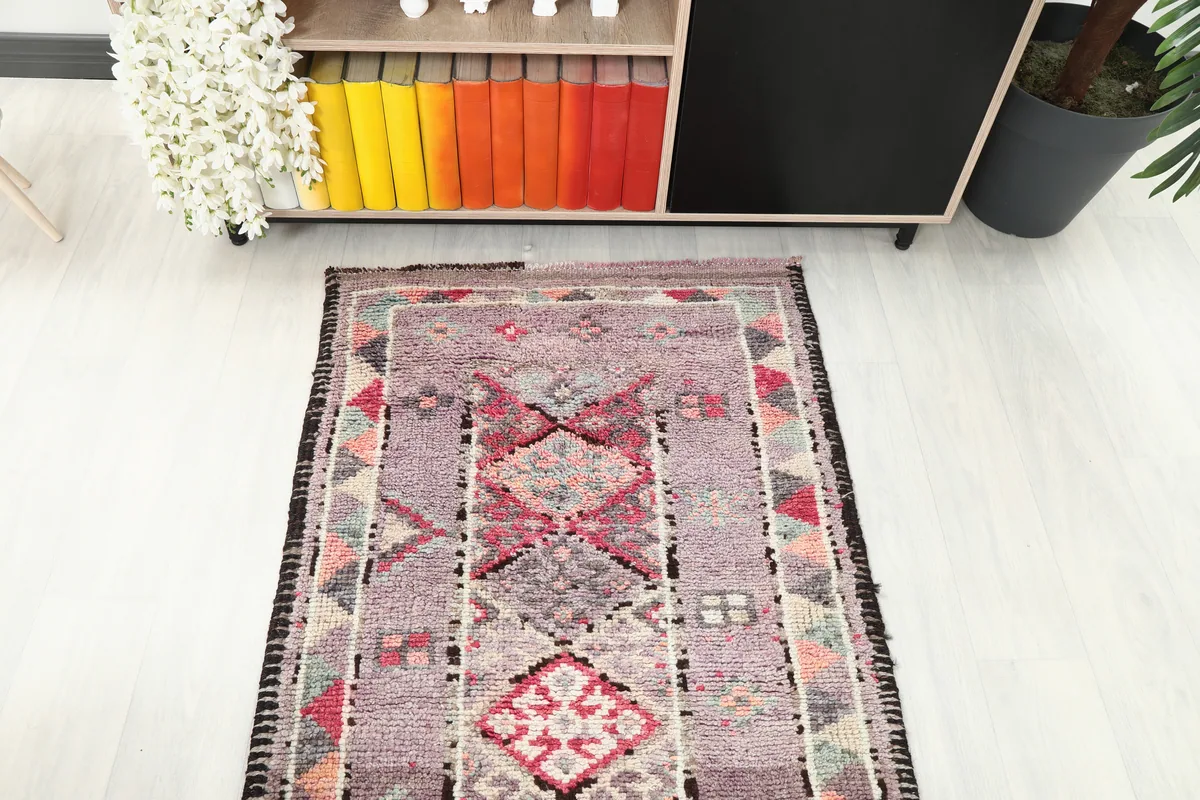 Overhead view of a section of the Purple Geometric Anatolian Runner, showing the repeat pattern.