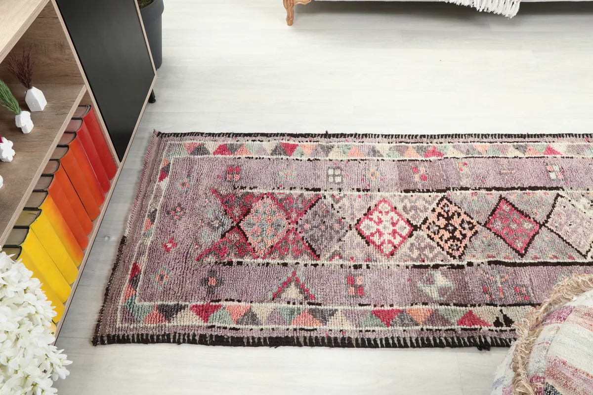 Purple Geometric Anatolian Runner laid out in a room, viewed from above, showing its length and pattern.