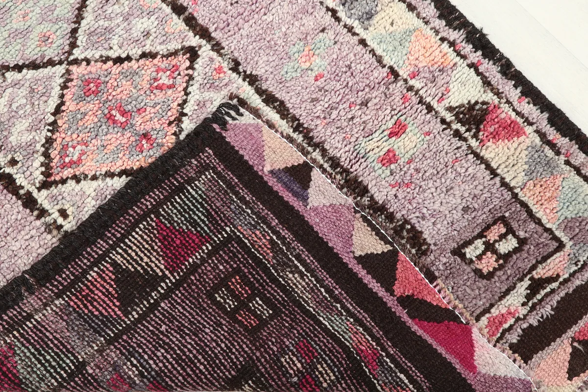 Close-up of the reverse side of the Purple Geometric Anatolian Runner, showing the cotton foundation and knotting.