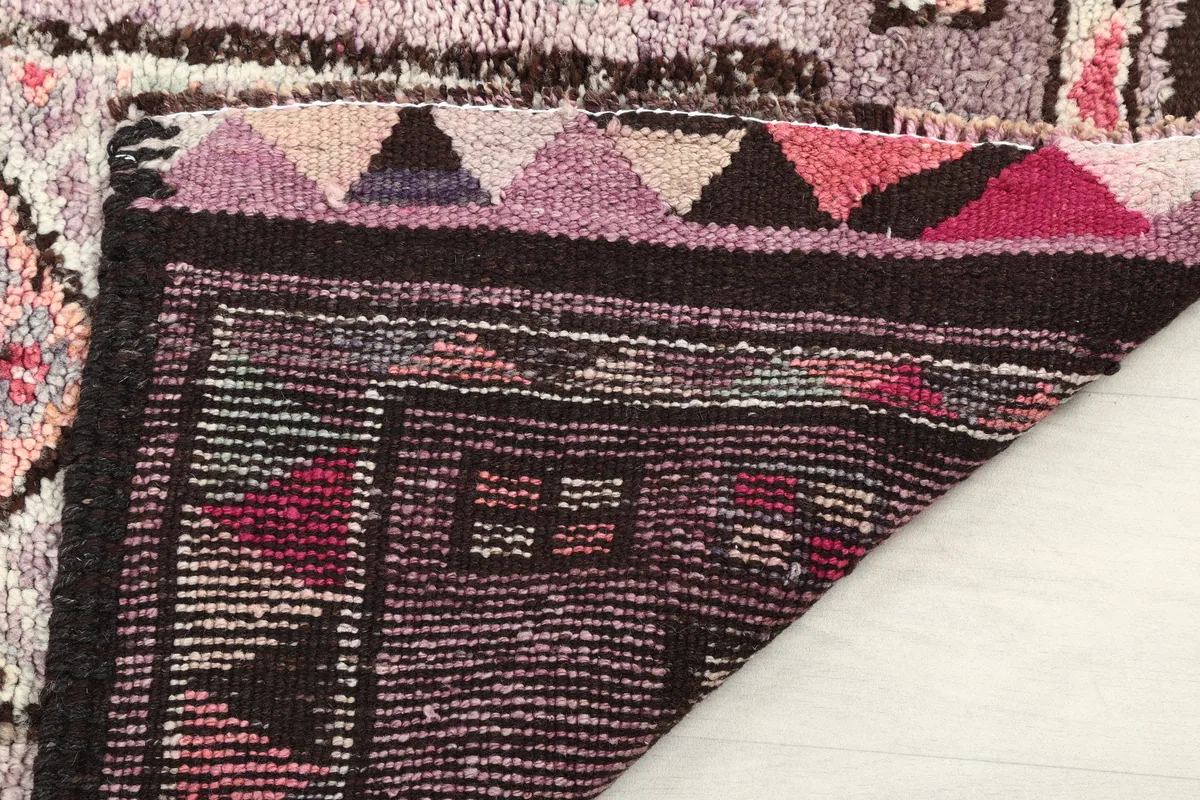 Detail of the back of the runner, emphasizing the tight hand-knotted construction and fringe.