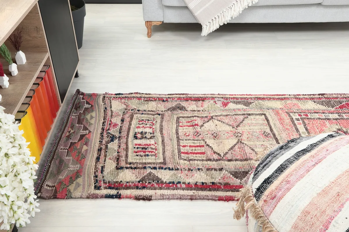 Wider shot of the runner rug in a room, illustrating its length and how it defines the space