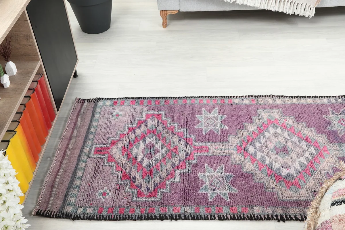 Angled view of the runner rug stretching across a light-colored floor in a room setting