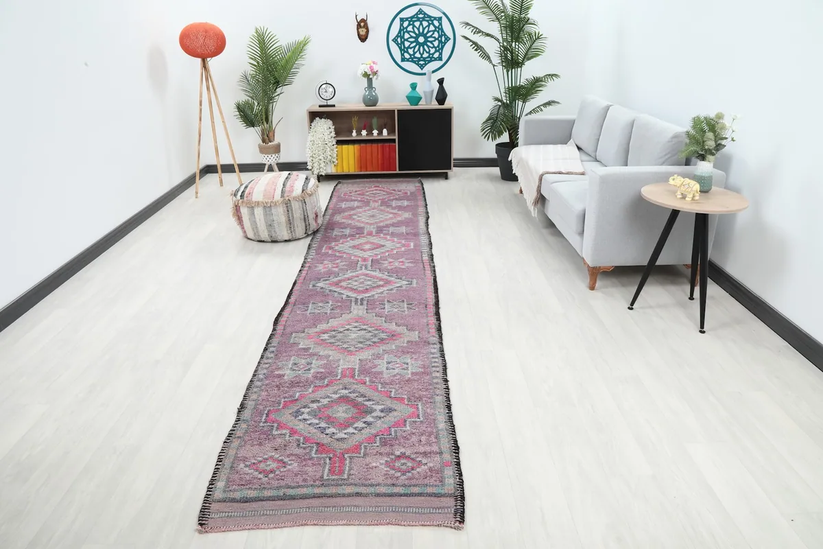 Rose geometric runner rug displayed in a modern hallway with light flooring and furniture