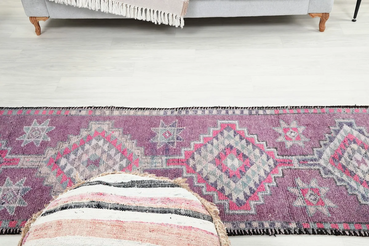 Overhead view of the middle section of the runner rug, showing the repeating motifs