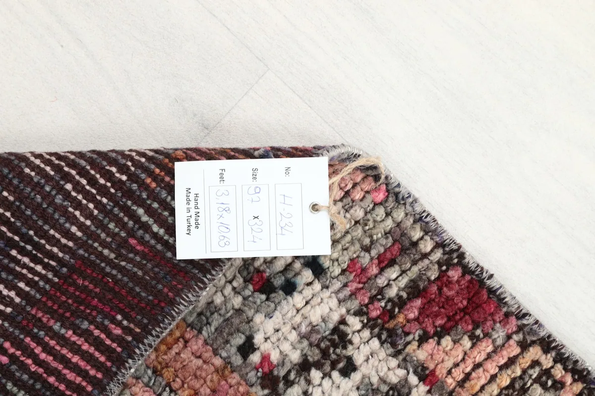 Corner of the rug with a tag displaying size and origin information.