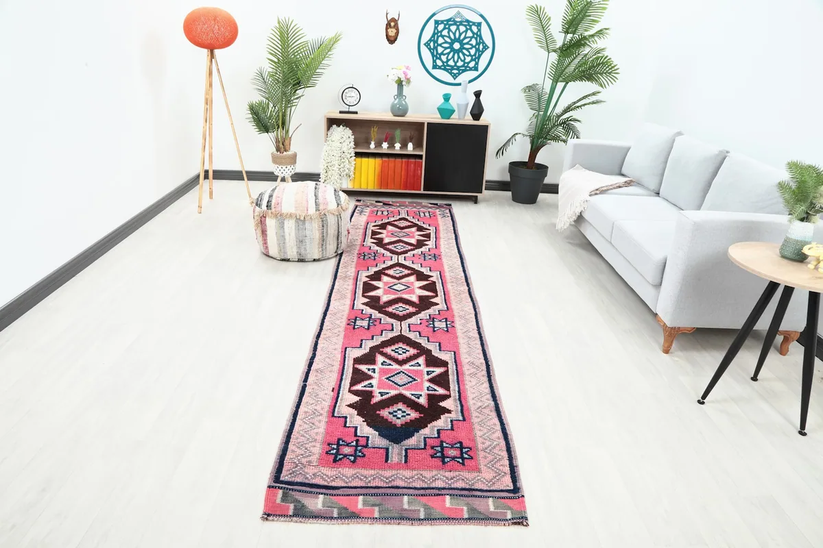 Runner rug displayed in a modern hallway setting with a sofa and decor