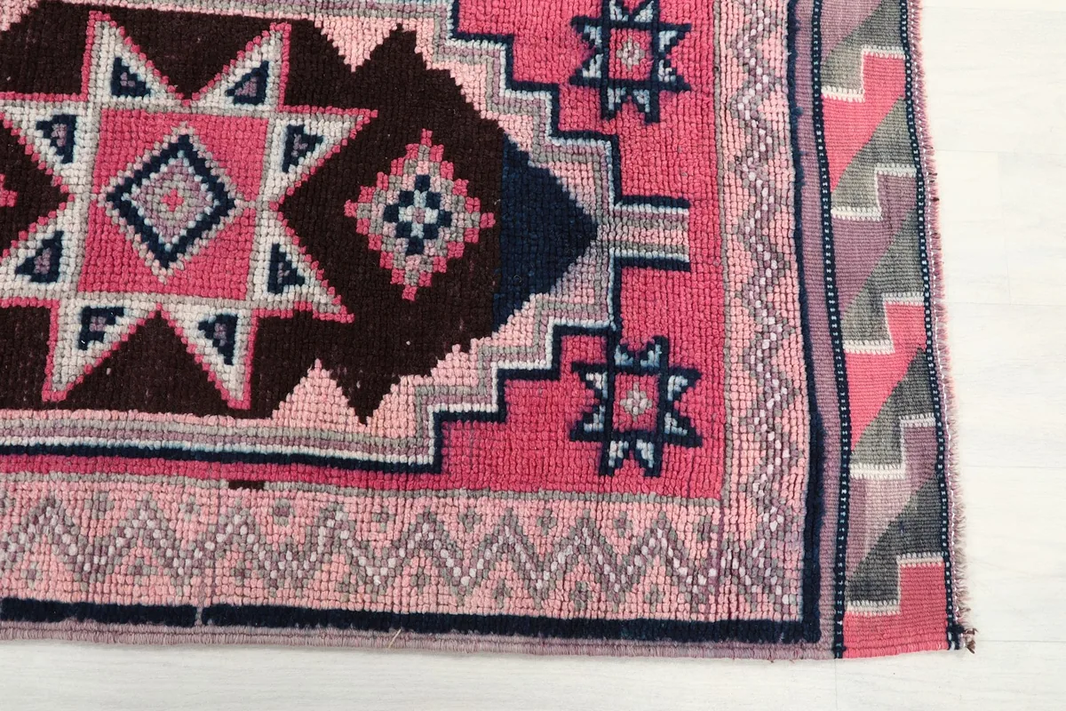 Detailed view of the geometric tribal patterns and border design
