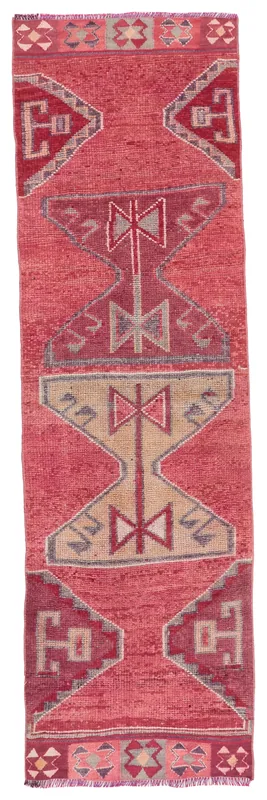 Full overhead view of the Rose Tribal Anatolian runner rug on a white background