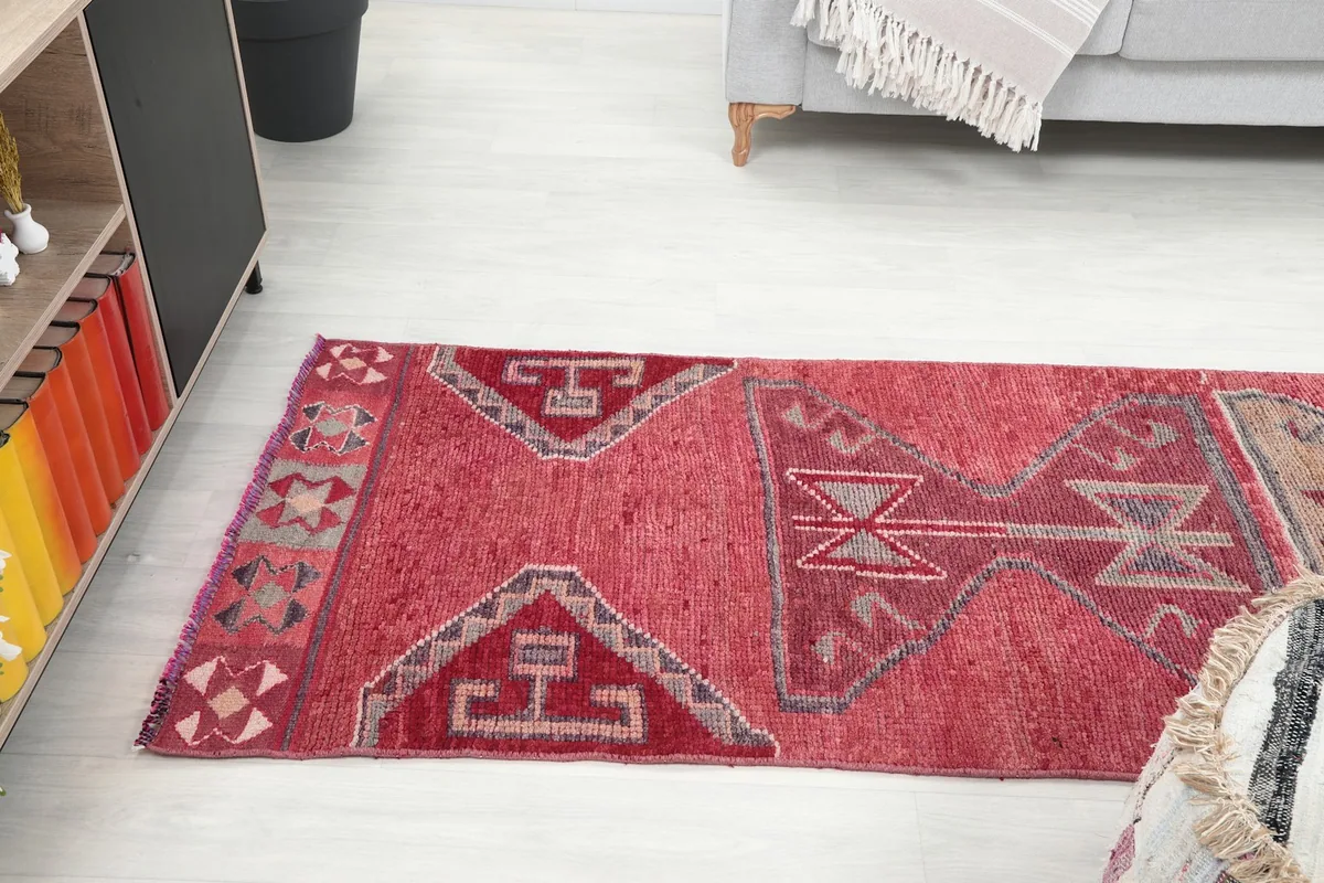 Upper section of the runner rug viewed from an angle in a room setting
