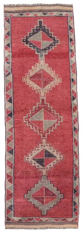 Full overhead view of the red diamond geometric vintage runner on a white background