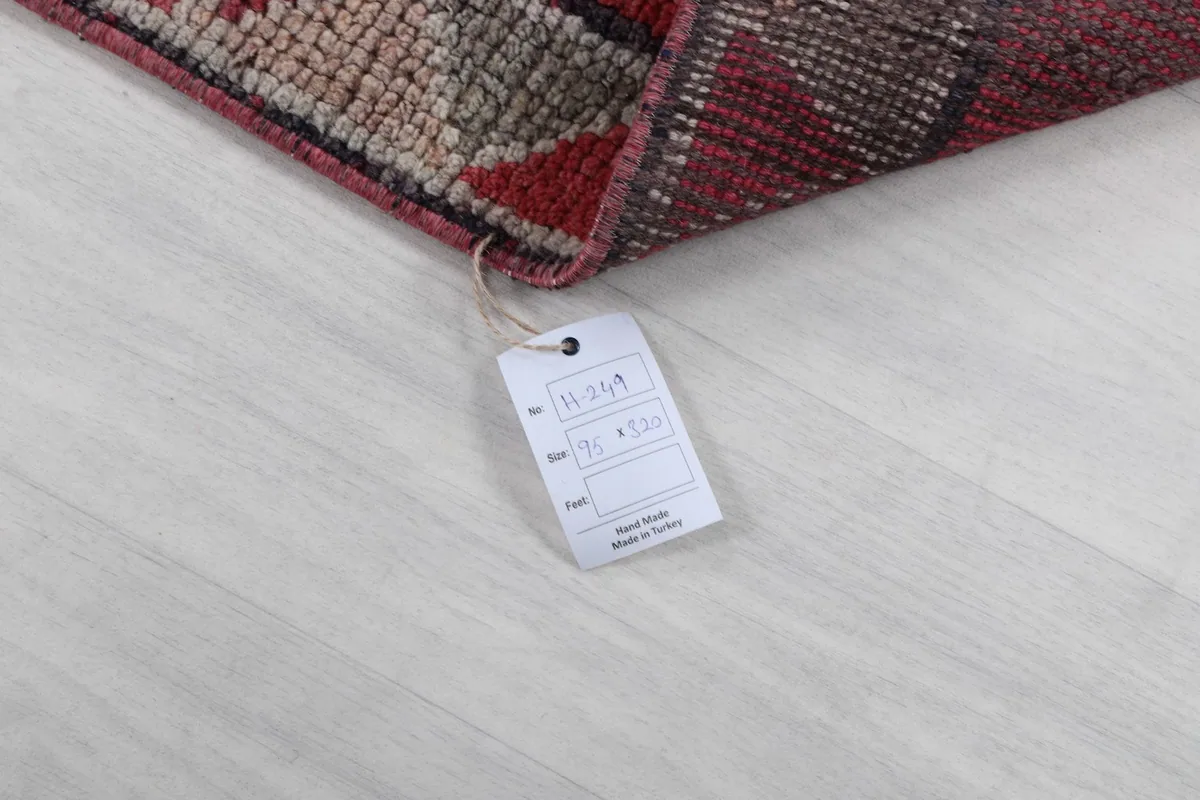 Product tag attached to the corner of the rug, displaying information about its size and origin