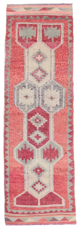Top view of a vintage rose and gray geometric Anatolian runner rug