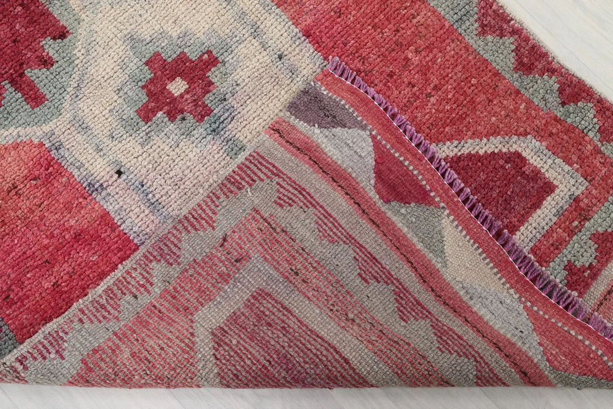 Underside view of the hand-knotted wool pile on cotton foundation